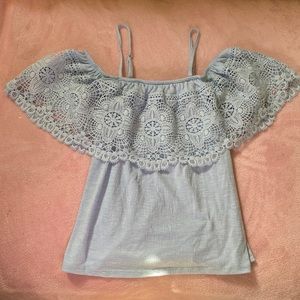Hi I am selling a baby blue tank top with lace around the top, made for chilren.
